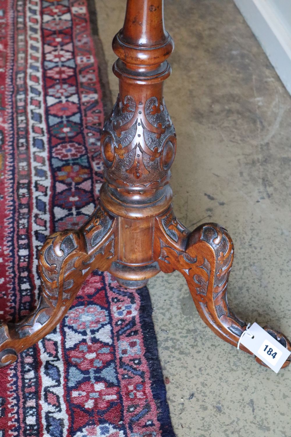 A Victorian carved walnut chess table, 60cm diameter, height 72cm